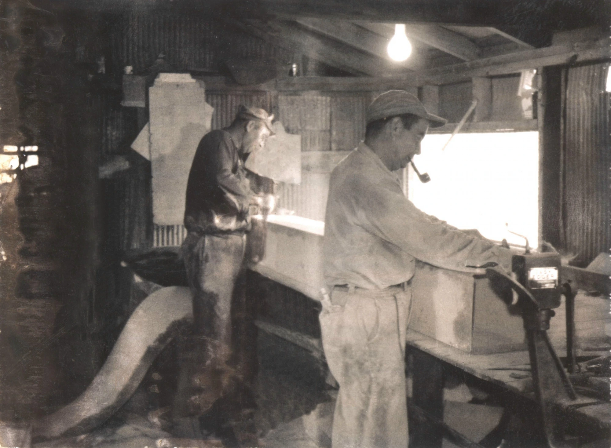 Workers manufacturing seed pan harvesters inside the B.E. Holbrooks Co. shop in Stanfield, NC