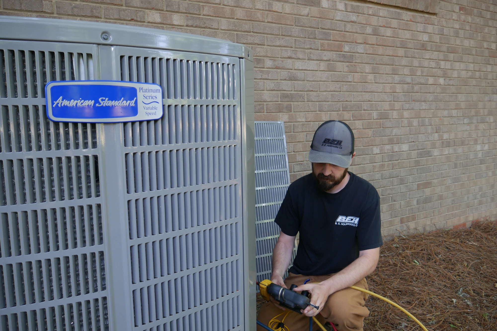 Technician servicing an American Standard Platinum air conditioner in the Stanfield, NC area